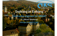 Foto der ZESS mit umgebenden Gebäuden und Bäumen in Herbst. Auf dem Foto stehen Titel und Datum des 23. UNIcert-Workshops.